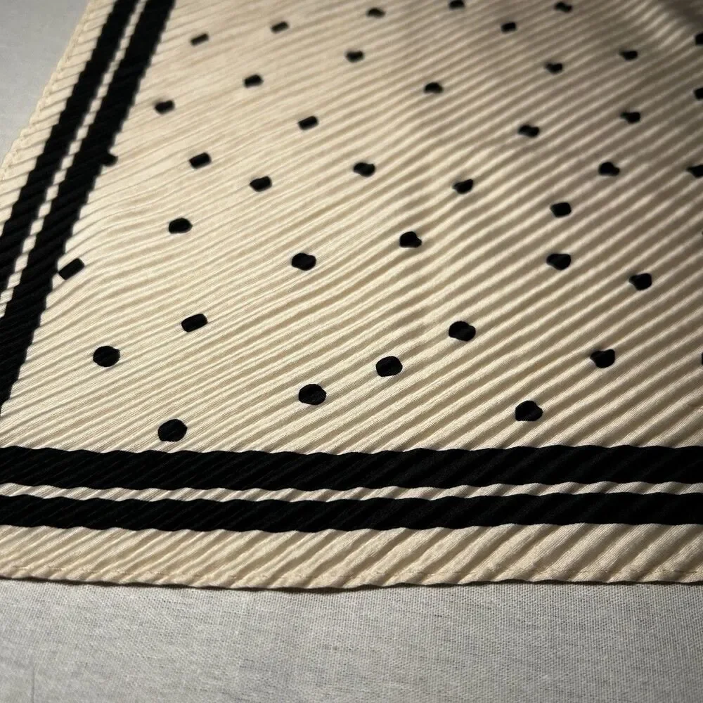 Reserved cream polka dot scarf, bold black border, pleated texture